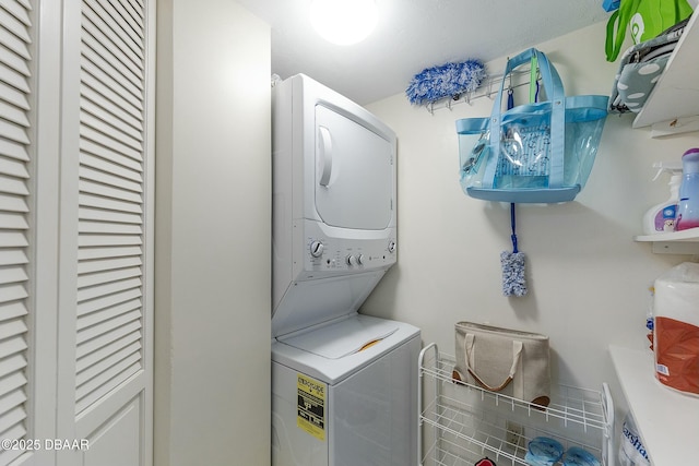 laundry area with laundry area and stacked washer and dryer