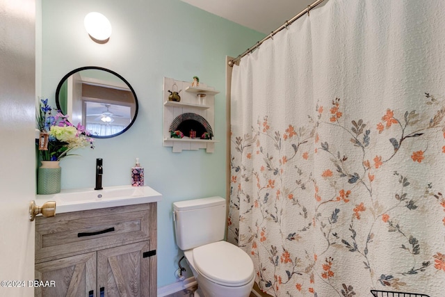 118 Lagoon Ct, New Smyrna Beach, FL 32169 - bathroom with toilet, a shower with curtain, vanity, and baseboards