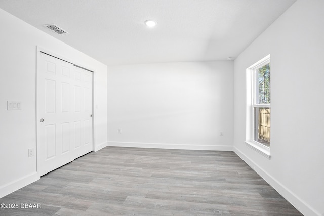 spare room with light hardwood / wood-style floors