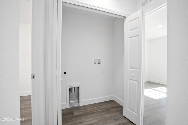 clothes washing area with dark hardwood / wood-style flooring and hookup for a washing machine