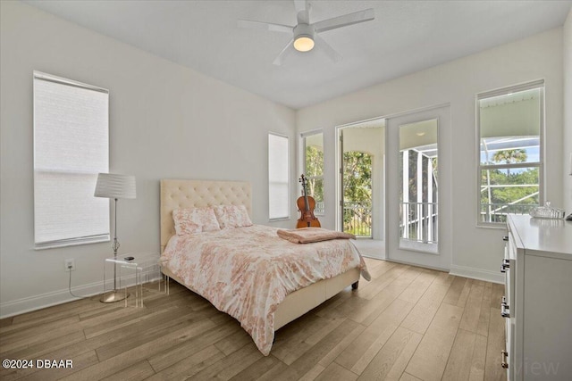 bedroom featuring ceiling fan, access to exterior, and light hardwood / wood-style flooring