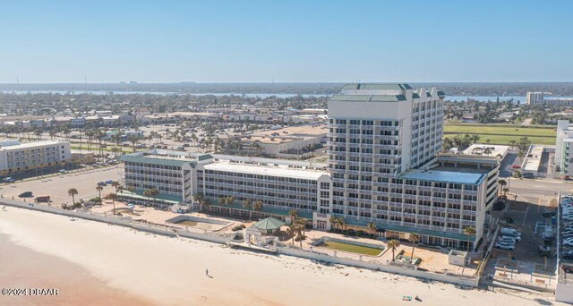 bird's eye view featuring a beach view and a water view