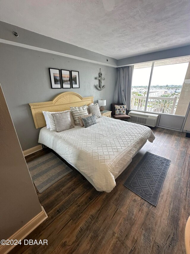 bedroom featuring dark hardwood / wood-style flooring