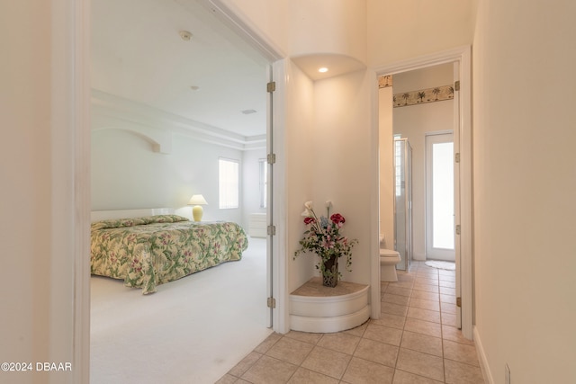 hall with light tile patterned flooring