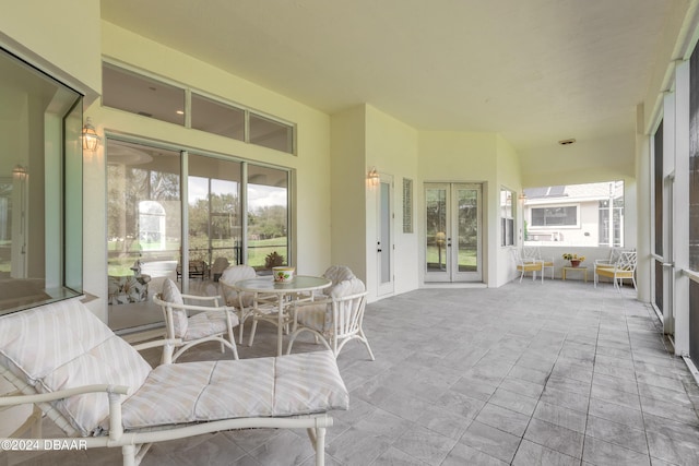 sunroom featuring french doors