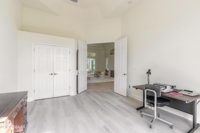 office with light wood-type flooring