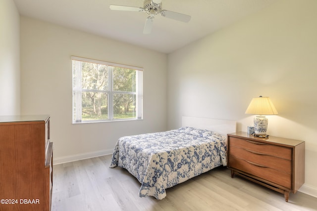 bedroom featuring ceiling fan and light hardwood / wood-style flooring