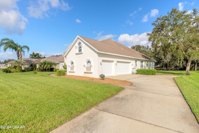 front facade featuring a front yard and a garage