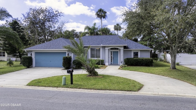 ranch-style home with a front yard and a garage