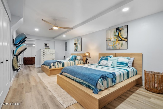 bedroom with light wood-type flooring and ceiling fan