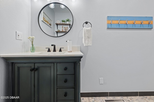 bathroom featuring tile patterned floors and vanity