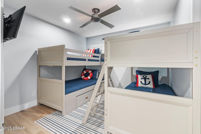 bedroom with ceiling fan and light wood-type flooring