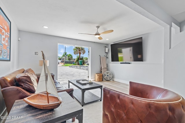 living room with ceiling fan and wood-type flooring