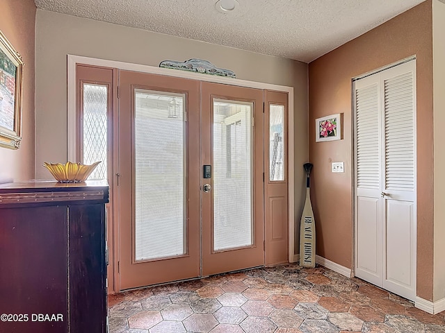 31 Sea Harbor Dr E Unit E, Ormond Beach, FL 32176 - foyer entrance featuring french doors and a textured ceiling