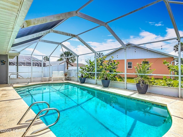 31 Sea Harbor Dr E Unit E, Ormond Beach, FL 32176 - view of swimming pool with glass enclosure and a patio area