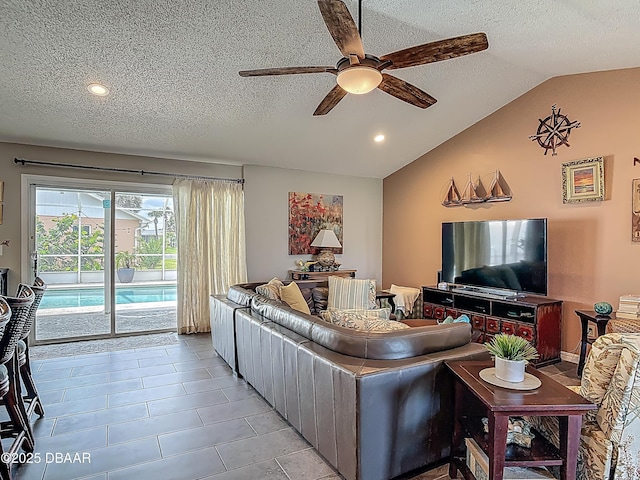 31 Sea Harbor Dr E Unit E, Ormond Beach, FL 32176 - living area featuring a ceiling fan, vaulted ceiling, a textured ceiling, recessed lighting, and light tile patterned flooring