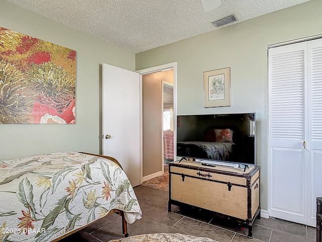 31 Sea Harbor Dr E Unit E, Ormond Beach, FL 32176 - bedroom with a textured ceiling and a closet