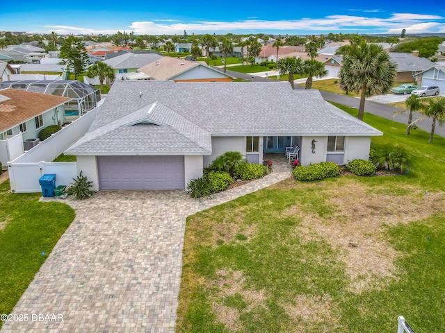 31 Sea Harbor Dr E Unit E, Ormond Beach, FL 32176 - ranch-style home featuring roof with shingles, an attached garage, and a residential view