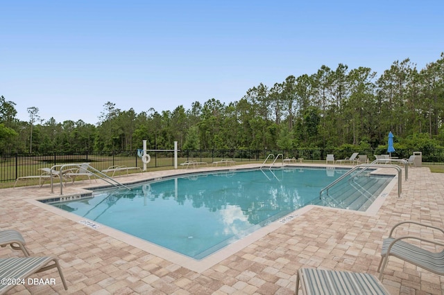 view of swimming pool featuring a patio area