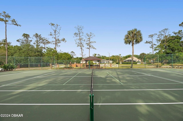 view of tennis court with a gazebo