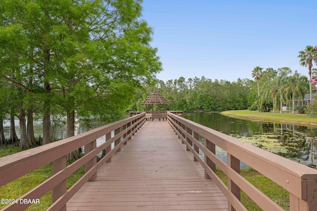 dock area with a gazebo and a water view