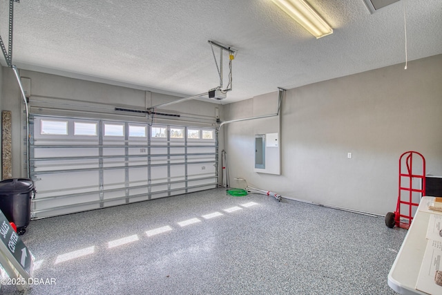 garage featuring a garage door opener and electric panel