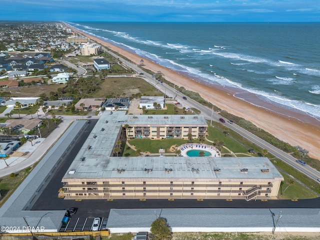 drone / aerial view featuring a view of the beach and a water view