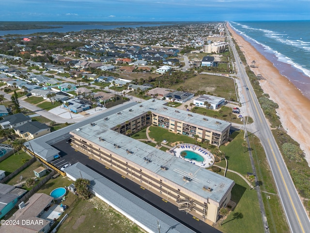 drone / aerial view with a view of the beach and a water view