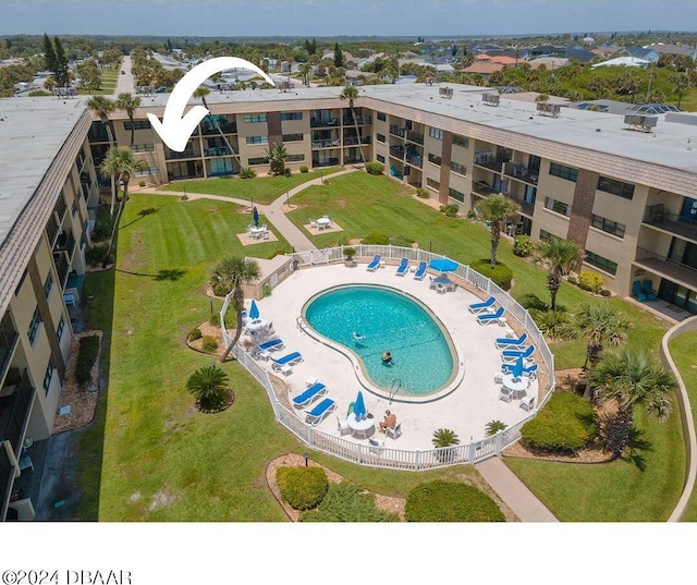 view of pool featuring a patio area, a yard, and a water slide