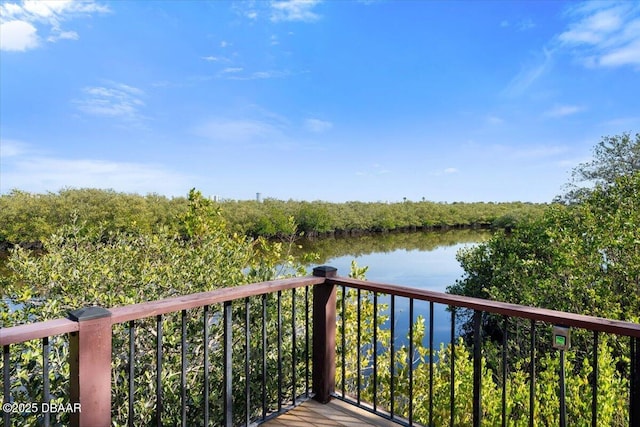 wooden deck featuring a water view