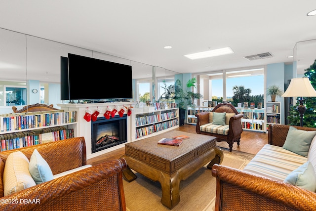 living room with light hardwood / wood-style flooring