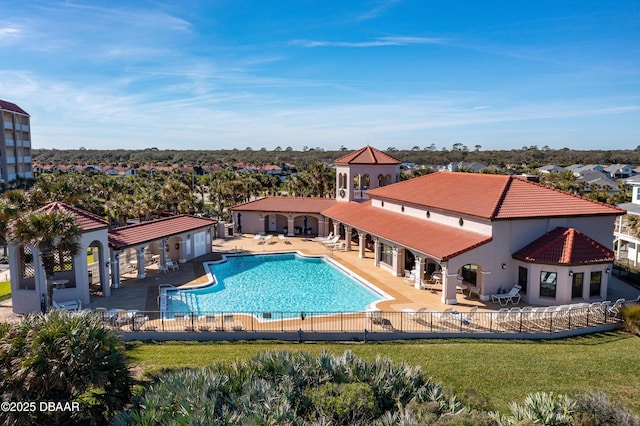 view of pool featuring a yard and a patio