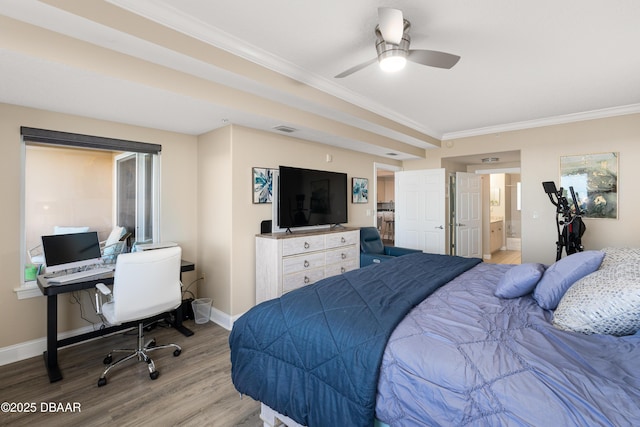 bedroom featuring ceiling fan, light wood-type flooring, ensuite bathroom, and ornamental molding