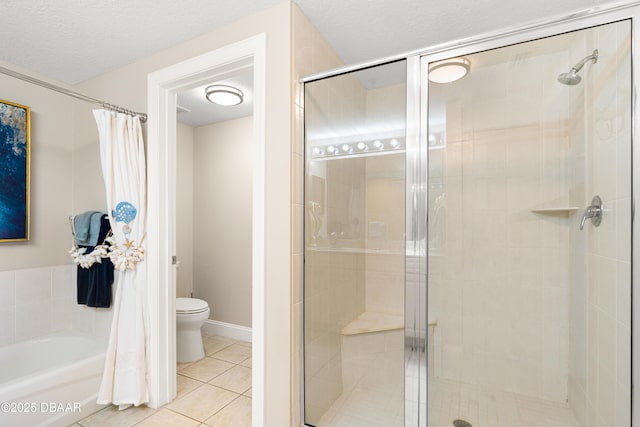 bathroom with toilet, a textured ceiling, separate shower and tub, and tile patterned floors