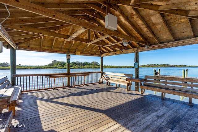 dock area featuring a gazebo and a deck with water view