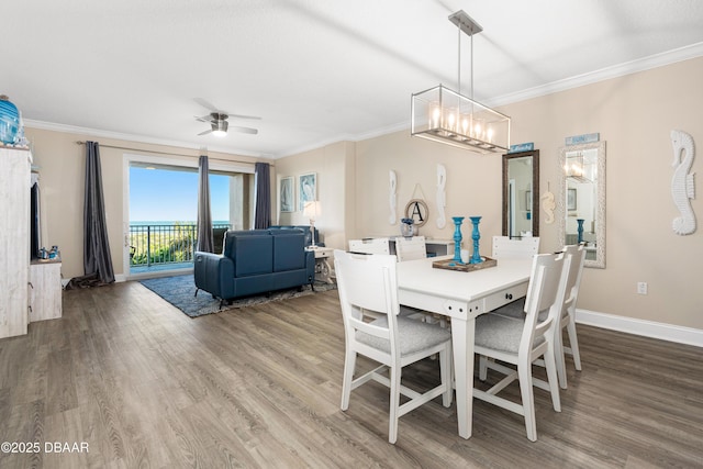 dining room with ceiling fan, crown molding, and hardwood / wood-style flooring