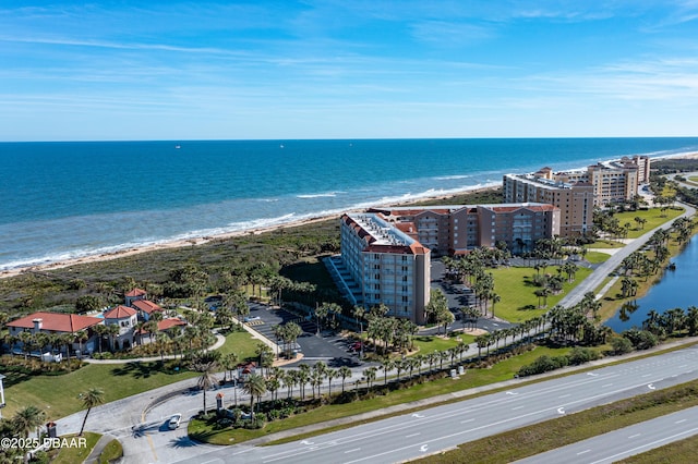 aerial view featuring a water view and a beach view