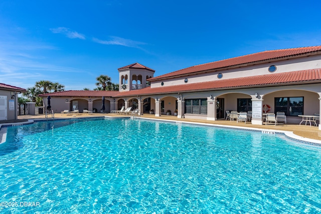 view of pool featuring a patio