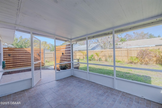 unfurnished sunroom with a healthy amount of sunlight