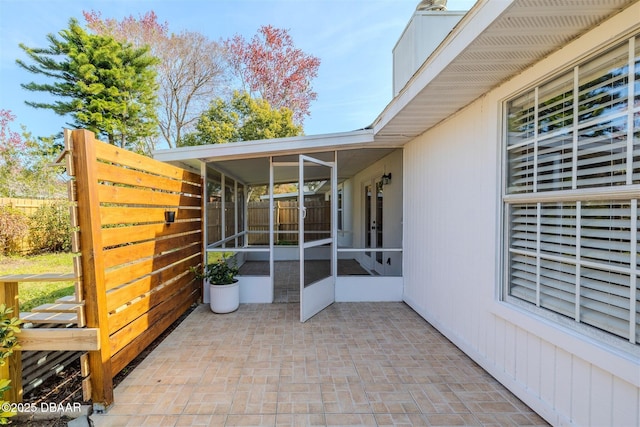 view of patio / terrace with a sunroom