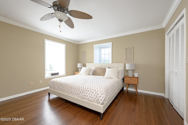 bedroom with multiple windows, ceiling fan, and a closet