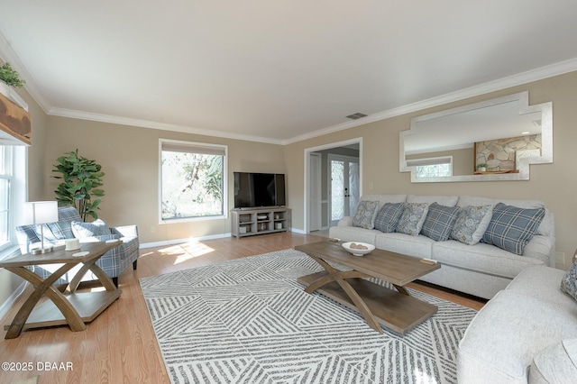 living room featuring crown molding and hardwood / wood-style floors