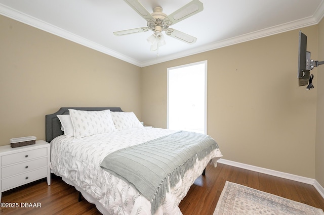 bedroom featuring dark wood-type flooring, ornamental molding, and ceiling fan