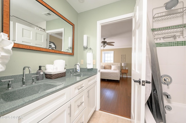 bathroom featuring crown molding, vanity, shower / bath combo, ceiling fan, and tile patterned flooring