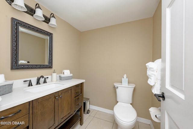 bathroom featuring vanity, tile patterned floors, and toilet