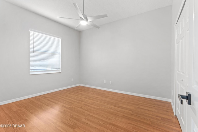 unfurnished room featuring a textured ceiling, ceiling fan, and light hardwood / wood-style floors