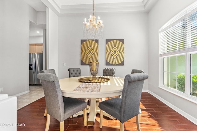 dining space with an inviting chandelier