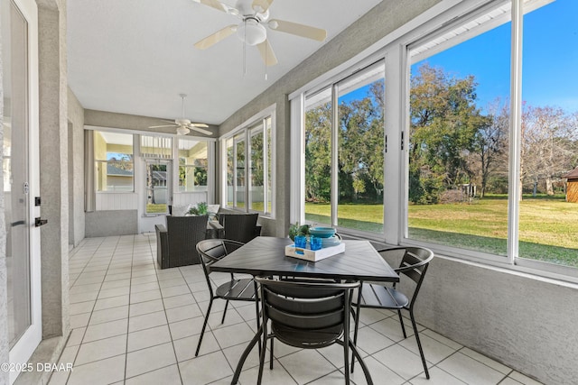 sunroom / solarium with a wealth of natural light and ceiling fan