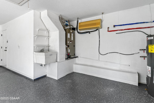 utility room featuring sink and water heater