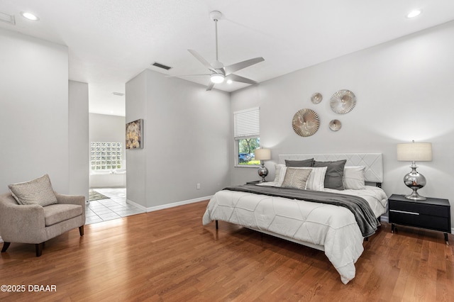 bedroom with hardwood / wood-style flooring and ceiling fan